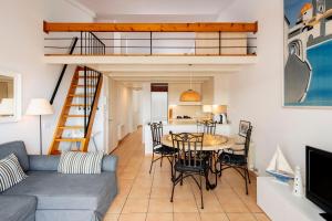 a living room with a couch and a table at Apartment Cadaques in Cadaqués