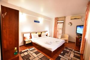 Un pat sau paturi într-o cameră la Hotel Euphoria