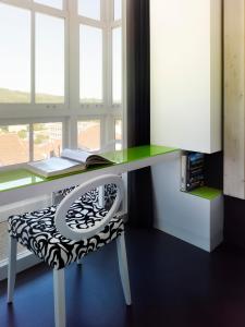 Telewizja i/lub zestaw kina domowego w obiekcie Moure Hotel