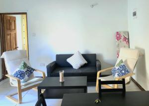 Χώρος καθιστικού στο Bay View Apartment 4 - Canouan Island
