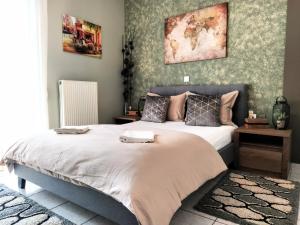 a bedroom with a large bed in a room at Elia Apartments in Athens +51 photos