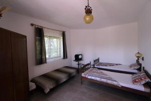 Posteľ alebo postele v izbe v ubytovaní Vöröskő apartmanház