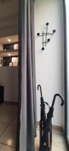 a pair of shoes sitting in a chair next to a wall at Etnea 365 Apartment in Catania