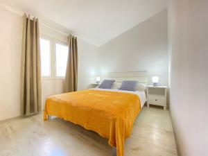 מיטה או מיטות בחדר ב-Apartment Kantun