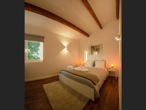 Ένα ή περισσότερα κρεβάτια σε δωμάτιο στο Quinta da Teimosa
