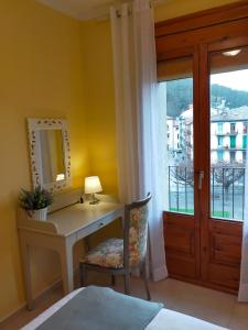 Posteľ alebo postele v izbe v ubytovaní Casa María, ático con vistas y parking
