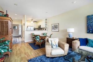 a living room with a couch and chairs and a table at Emmalani Court 312 condo in Princeville
