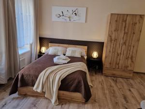 Posteľ alebo postele v izbe v ubytovaní ApartHouse Apartamenty Centrum - In the city center Near the train station