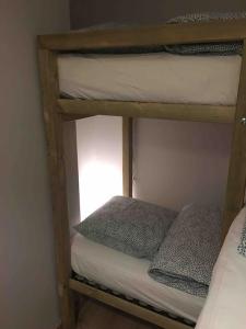 a couple of bunk beds in a room at villa la marine in Cayeux-sur-Mer