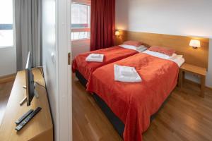 Ліжко або ліжка в номері Levi Chalet Ski In-Out apartment