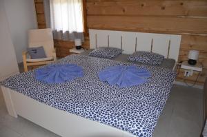 Posteľ alebo postele v izbe v ubytovaní Apartmány u vlčích jam