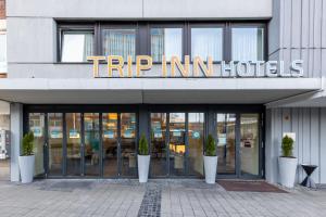 a building with a sign that reads trip inn hotels at Trip Inn Hotel Münster City in Münster