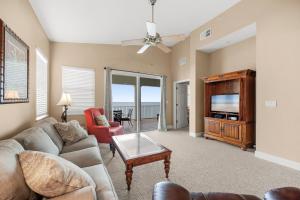a living room with a couch and a tv at 561 Cinnamon Beach in Palm Coast