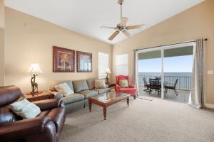 a living room with a couch and a table at 561 Cinnamon Beach in Palm Coast
