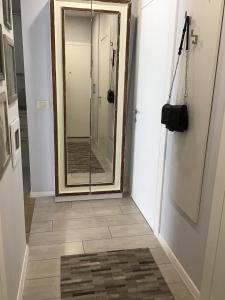 a bathroom with a mirror and a walk in shower at Sole in Makarska +11 photos