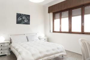מיטה או מיטות בחדר ב-Villa Liliana - Large Private House in Vicopisano