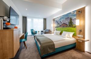 Postel nebo postele na pokoji v ubytování AVALON Hotel Bad Reichenhall + 37 fotografií