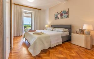 Posteľ alebo postele v izbe v ubytovaní Apartment Melanie