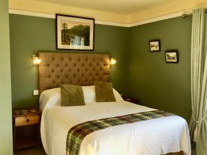 Ένα ή περισσότερα κρεβάτια σε δωμάτιο στο Buttermilk Lodge Guest Accommodation