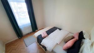 Postel nebo postele na pokoji v ubytování SMARAGD Apartman