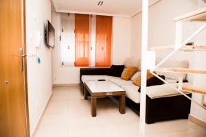 Posteľ alebo postele v izbe v ubytovaní DUPLEX LOFT en la PLAYA