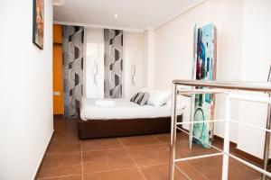 Posteľ alebo postele v izbe v ubytovaní DUPLEX LOFT en la PLAYA
