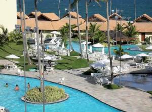 a view of the pool at the resort at Suíte na beira-mar do Resort Marulhos Muro Alto Porto Galinhas in Porto De Galinhas