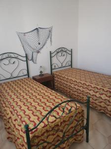 Posteľ alebo postele v izbe v ubytovaní Casa vacanze a Pescoluse