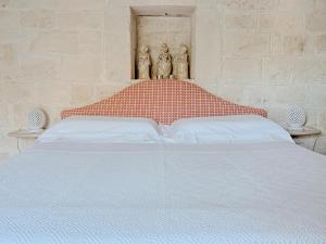 Postel nebo postele na pokoji v ubytování Trullo Santangelo