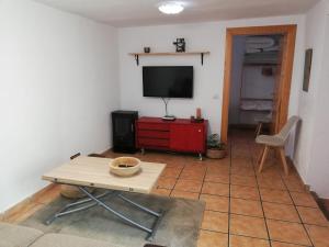 Televízia a/alebo spoločenská miestnosť v ubytovaní La buganvilla de Juana y Antonio