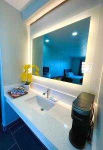 a bathroom with a sink and a mirror at Villa Serena in El Cajon +51 photos