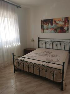 Postel nebo postele na pokoji v ubytování Casa vacanze a Pescoluse