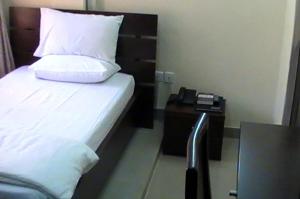 Ένα ή περισσότερα κρεβάτια σε δωμάτιο στο Koraf Hotels