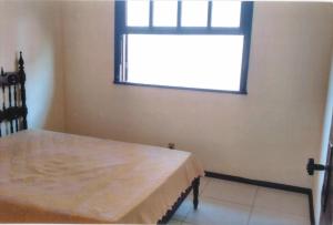 Ένα ή περισσότερα κρεβάτια σε δωμάτιο στο Apartamento Iguaba Grande, bairro Canellas City , em frente ao trailer do popeye