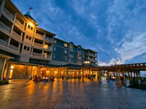 a large building with a patio in front of it at 1000 Islands Harbor Hotel in Clayton