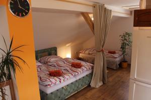 Postel nebo postele na pokoji v ubytování Orange Loft Apartment