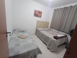 Ένα ή περισσότερα κρεβάτια σε δωμάτιο στο Apto 1 Agua Marinha