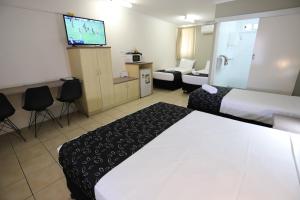 Postel nebo postele na pokoji v ubytování Tropic Coast Motel