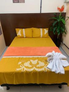 Una cama o camas en una habitación de Pousada 461