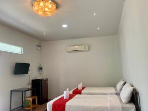 Postel nebo postele na pokoji v ubytování โรงแรมแอมไอม่อน - Am Amoonds Hotel + 31 fotografií