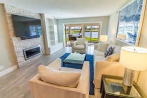 a living room with a couch and a fireplace at Ponte Vedra The Pointe G1, Golf View, 3 Bedrooms, Sleeps 6 in Ponte Vedra