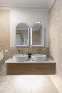 two sinks in a bathroom with two mirrors at Mount Gambier Hotel in Mount Gambier +63 photos