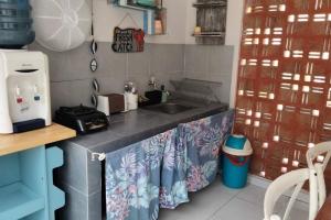 a kitchen with a sink and a counter top at Maison de Q - 2 BR at Villa Ubud B 12 Anyer in Babagan