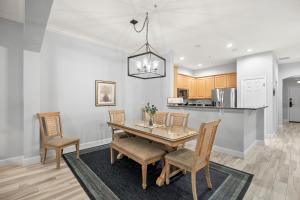 a kitchen and dining room with a table and chairs at 824 Cinnamon Beach, 3 Bedroom, Sleeps 8, Ocean Front, 2 Pools, Elevator in Palm Coast