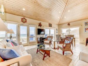 a living room with a couch and chairs at Ocean Pearl in Saint Augustine
