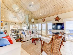 a living room with a couch and a table at Ocean Pearl in Saint Augustine