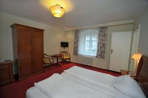 Postel nebo postele na pokoji v ubytování Hotel Goldener Löwe