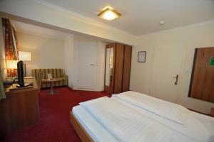 Postel nebo postele na pokoji v ubytování Hotel Goldener Löwe