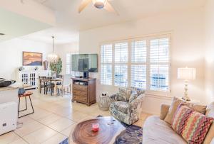 a living room with a couch and a table at Las Marinas Condominiums with Boat Docks in South Padre Island