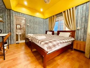 Llit o llits en una habitació de Shin Sane Guest House